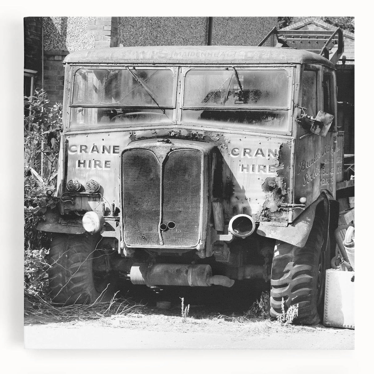 Black and white photo of a derelict building on stretched canvas, ideal for kitchen wall art or bedroom ambiance.