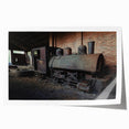 Rolled print of a dilapidated building in muted gray and earth tones, suitable for art wall dining room.