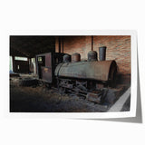 Rolled print of a dilapidated building in muted gray and earth tones, suitable for art wall dining room.