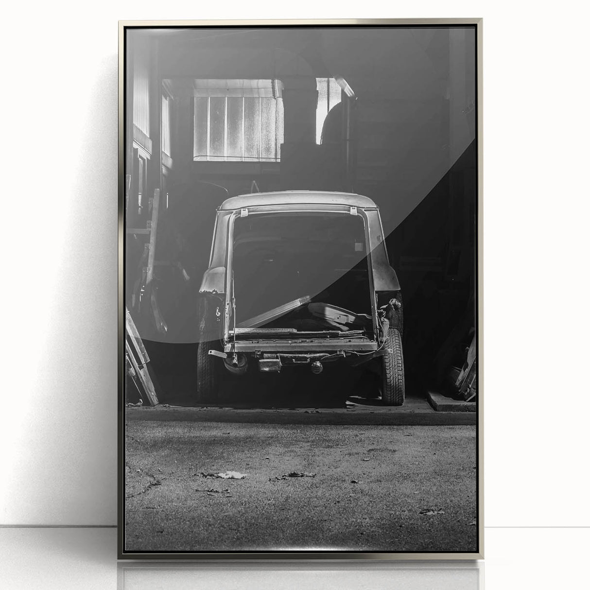 Mid-century modernist art depicting an abstract cityscape in muted gray and blue tones on a silver-framed acrylic print.