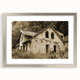 Textured abstract art print in muted gray, featuring derelict architectural elements, framed in silver.