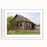 Abstract art print featuring geometric patterns in neutral shades on a white framed canvas.