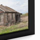 Close-up of black wall art featuring a textured, colorful abstract design on a framed canvas, suitable for a living room.