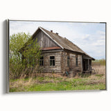 Landscape art painting depicting a derelict building, in muted gray and silver tones on a framed canvas.