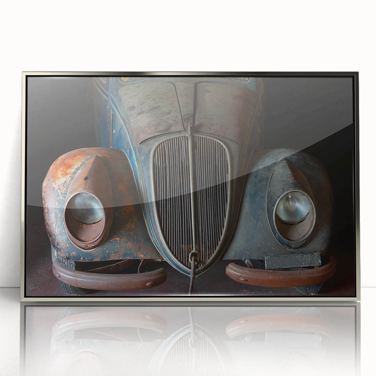 Mid-century modernist art depicting an abstract cityscape in muted gray and blue tones on a silver-framed acrylic print.