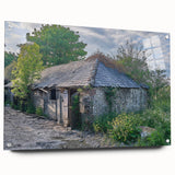Large abstract wall art on acrylic glass depicting a derelict building, in muted grays and blues.