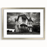 Textured abstract art print in muted gray and blue tones on a silver-framed canvas, ideal for modern bedroom ambiance.