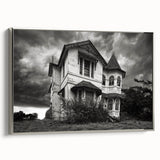 Framed canvas featuring a vintage landscape art painting of a derelict building in muted black and colorful tones.