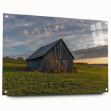 Large abstract wall art on acrylic glass depicting a derelict building, in subdued gray and blue tones.