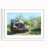 Abstract art print of a dilapidated building in muted gray and blue tones on a framed poster, suitable for dining room decor.