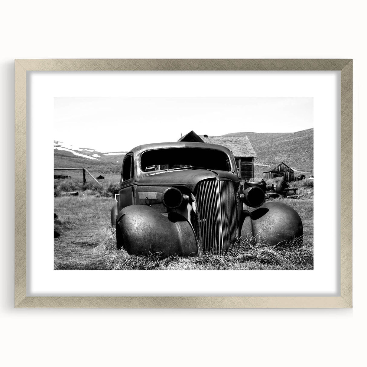 Textured abstract art print in muted grays and blues, framed in silver, ideal for bedroom art.