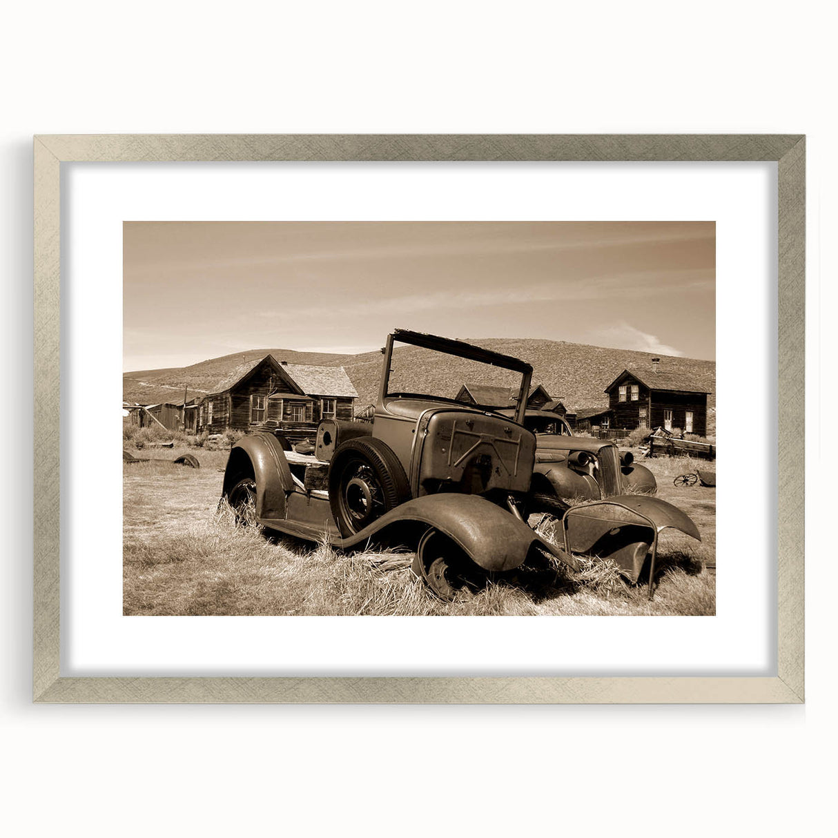 Textured abstract art print in silver frame, featuring a blend of gray and white tones, suitable for bedroom decor.