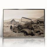 Mid-century modernist art of derelict buildings in muted gray tones, acrylic print in a silver frame.