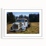 Large abstract wall art depicting a derelict architectural design in muted gray and blue tones, framed with a white mat.
