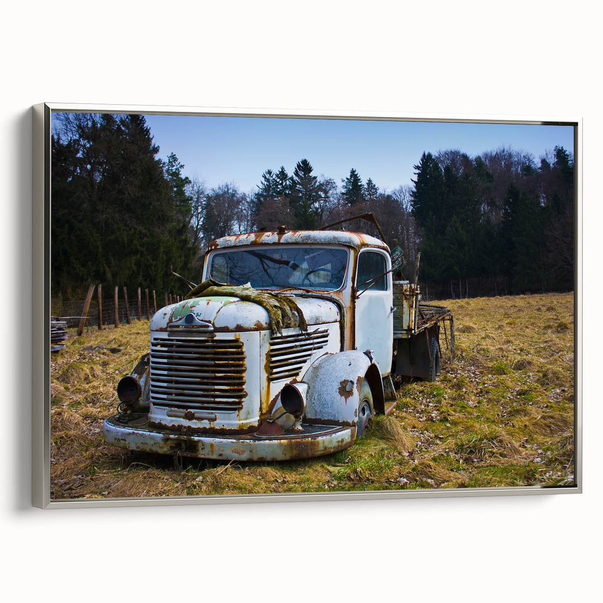 Framed canvas landscape art painting featuring a derelict building in muted grays and blues.