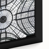 Close-up of black wall art featuring colorful, textured architecture domes on a framed canvas.