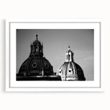 Abstract art prints featuring geometric domes in muted grays, framed in white, ideal for dining room decor.