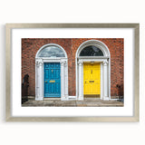 Abstract art print featuring geometric patterns in black and white, framed in silver.