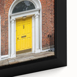 Close-up of a black wall art canvas featuring a colorful, textured door design, ideal for extra large living room decor.