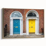 Framed canvas featuring a landscape art painting of a colorful vintage door design in gold, black, and vibrant hues.