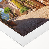 Art deco poster featuring geometric patterns and bold black and gold colors on rolled canvas, suitable for dining room decor.