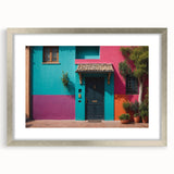 Abstract art print of a stylized door in muted gold and beige tones, framed in silver.