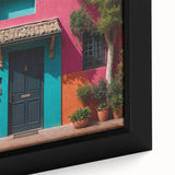 Close-up of a black wall art featuring a colorful, textured door design on a framed canvas, ideal for living room decor.