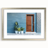 Abstract art print featuring a complex geometric pattern in black and white, framed in silver, ideal for dining room decor.