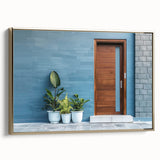 Framed canvas of a vintage poster featuring a colorful landscape art painting with black borders.