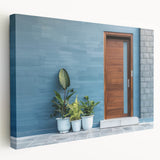 Side view of a large stretched canvas featuring a detailed architectural door design in neutral tones.