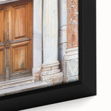 Close-up of extra large black wall art featuring a colorful, textured door design on framed canvas.