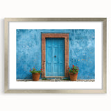 Abstract art print of a stylized door in muted gray and silver tones, framed with a silver mat.