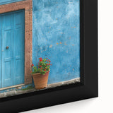 Framed canvas featuring a close-up of a black door with vibrant, textured colors, ideal for living room decor.