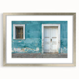 Abstract art print of a stylized door in silver frame, featuring muted gray and blue tones, ideal for dining room decor.