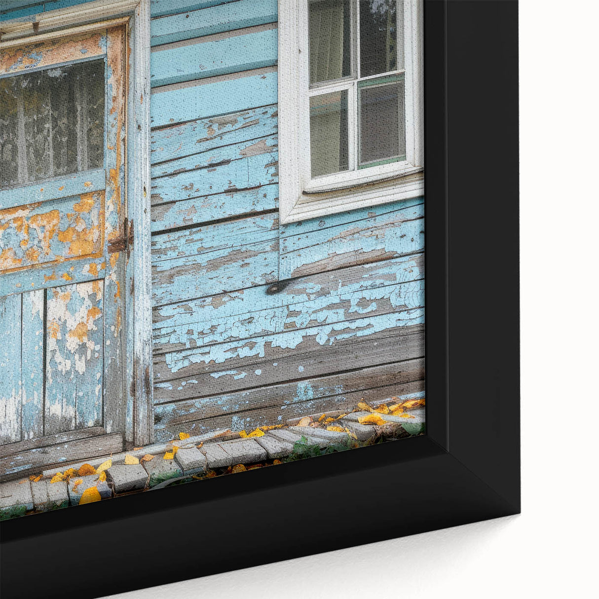 Close-up of a black framed canvas featuring a colorful, textured door design, ideal for living room decor.