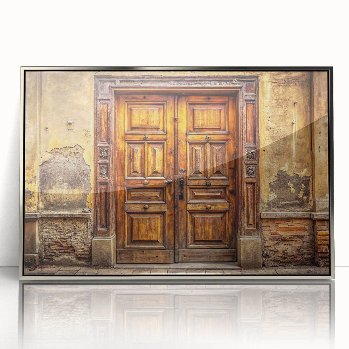 Art deco poster featuring a silver-framed acrylic print of an ornate door design in monochrome.