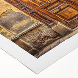 Art deco poster featuring a bold geometric pattern in black and gold on a rolled canvas, suitable for dining room decor.