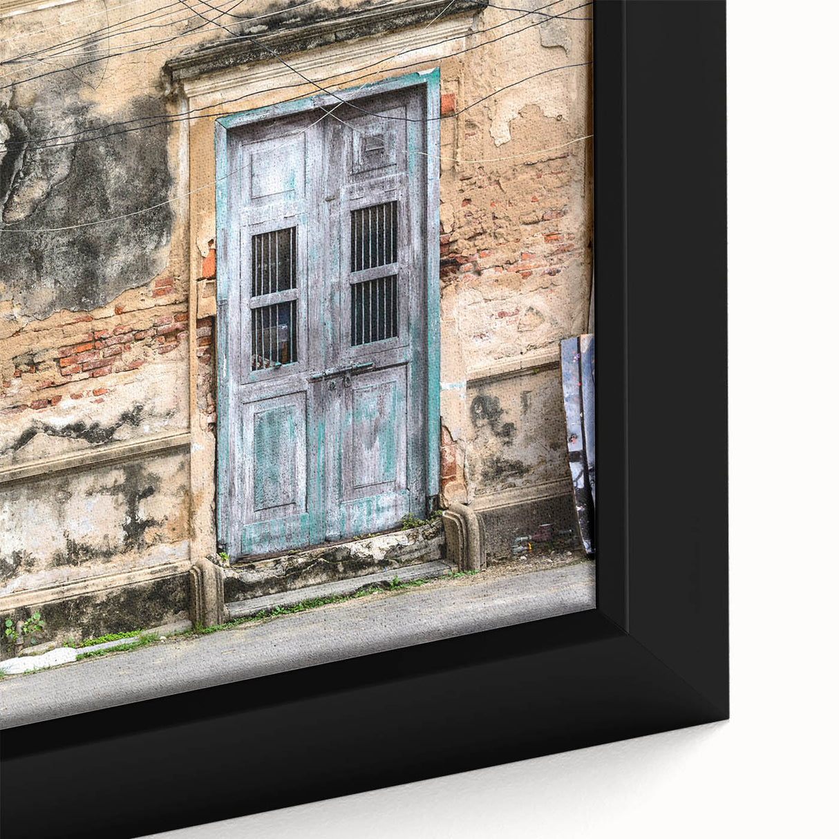 Close-up of a black framed canvas featuring a colorful, textured door design, ideal for extra large living room wall art.