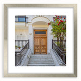 Abstract art print featuring geometric shapes in muted blue and gray tones on a framed poster.