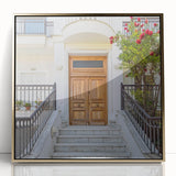 Mid-century modernist art featuring an architectural door design in gold and black tones on a framed acrylic panel.