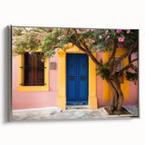 Extra large framed canvas of vintage poster art featuring a colorful, intricate door design on a black background.