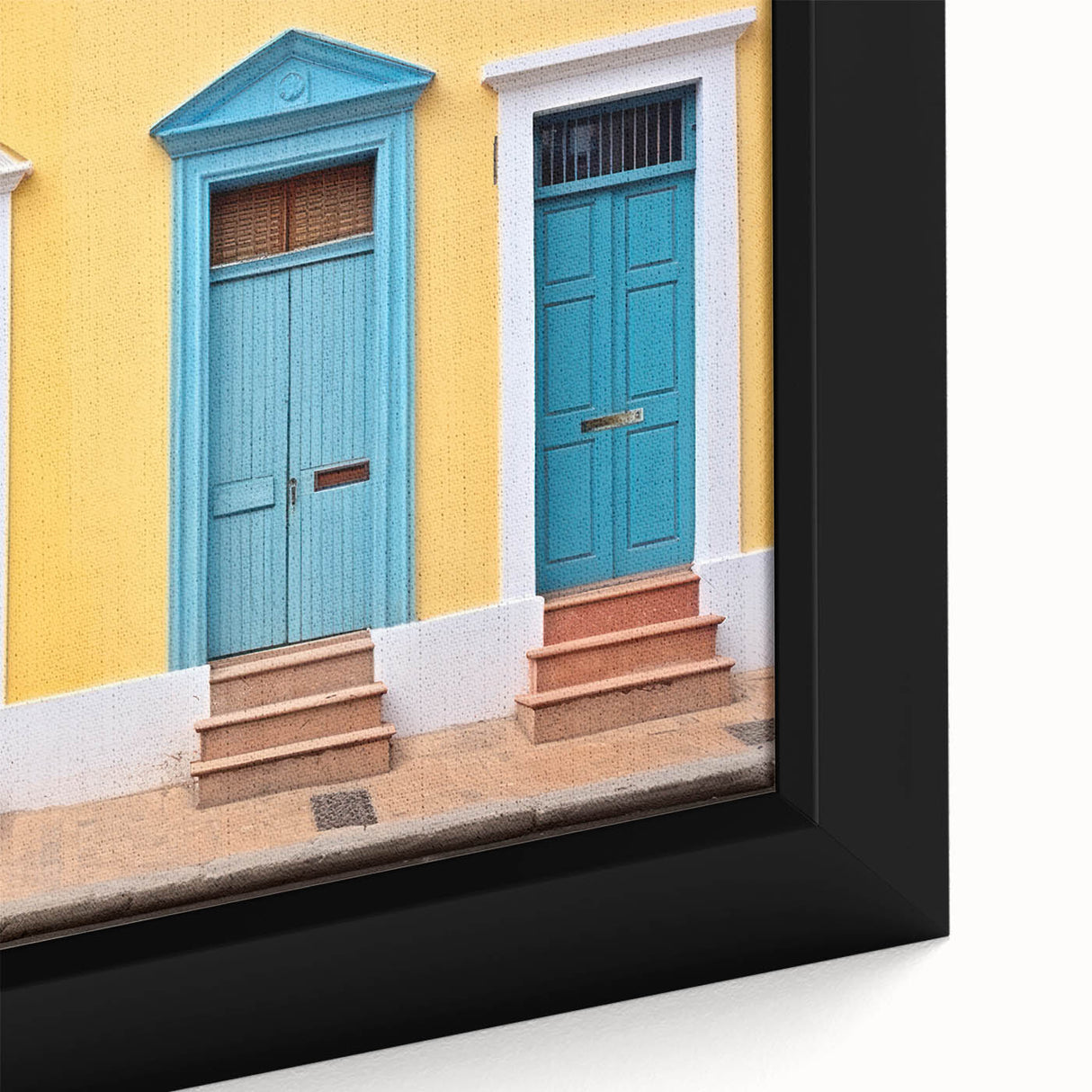 Close-up of a black framed canvas featuring a colorful, textured door design, ideal for extra large living room wall art.