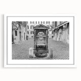 Abstract art print featuring a fountain design in muted gray, framed in white, ideal for dining room decor.