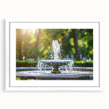 Abstract art print featuring flowing water design in blue and white tones, framed with a white mat.