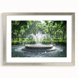 Textured art print of an abstract fountain design in muted gray tones on a framed silver mat, suitable for bedroom decor.