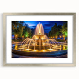 Abstract art print featuring a fluid fountain design in silver and gray tones, framed with a silver mat.