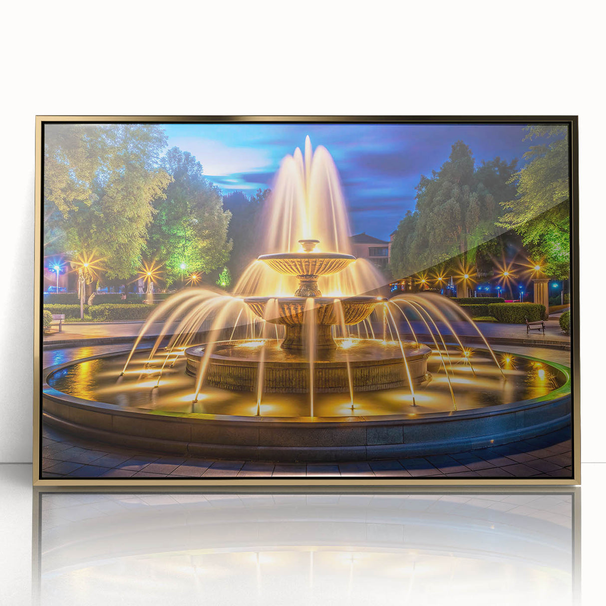 Mid-century modernist acrylic print of an architectural fountain design in gold tones, framed.