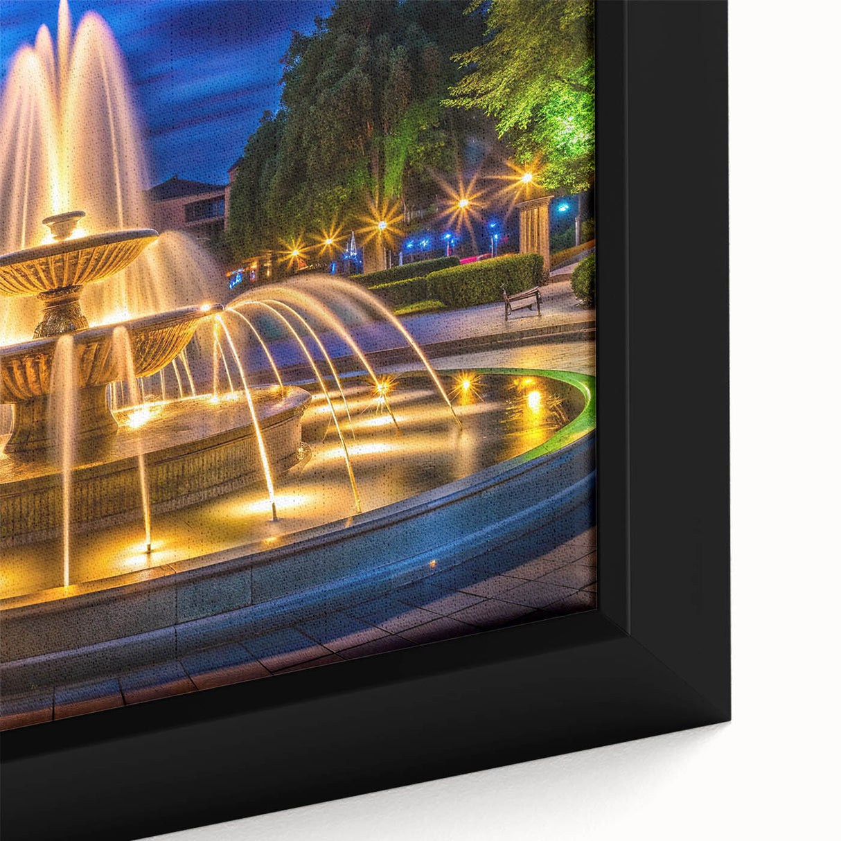 Close-up of a black framed canvas featuring a textured, colorful abstract design, ideal for living room decor.