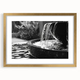Extra large abstract art print featuring a textured fountain design in muted gold tones, framed with a mat.