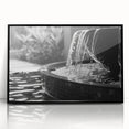 Large abstract wall art depicting a geometric fountain design in black and white tones on a framed acrylic panel.